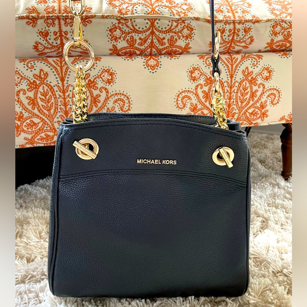 Black leather shoulder/crossbody tote with gold chain and hardware.